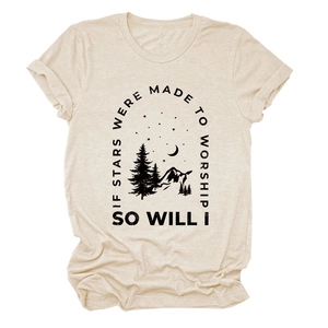 Detail of oat-colored T-shirt with mountain and star screen print and 'So Will I' text