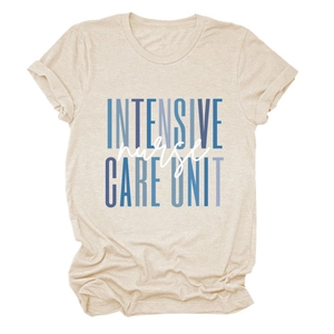 Detailed view of the Intensive Nurse Care Unit text print on a beige crewneck t-shirt