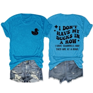 Flat lay of blue crew neck T-shirt with duck print and distressed denim shorts