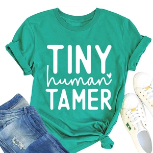 Detail of teal cotton t-shirt with TINY human TAMER print and rolled cuff sleeve