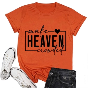 Close-up of orange cotton t-shirt with black make heaven crowded text and heart graphic