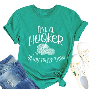 Turquoise T-shirt with funny crochet pun print and white yarn ball illustration