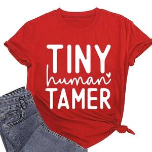 Detail of red cotton t-shirt featuring TINY human TAMER text and stylish side knot