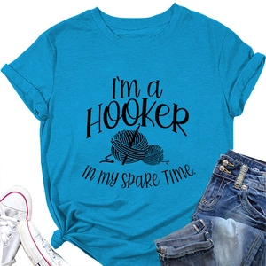 Detail of sky blue cotton T-shirt featuring 'I'm a Hooker' crochet graphic and text
