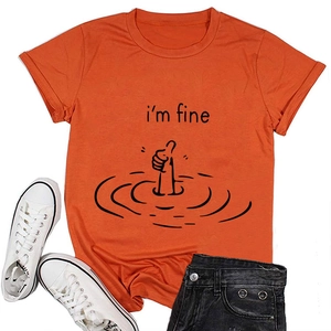 Orange 'i'm fine' graphic t-shirt with sneakers and black denim shorts flat lay