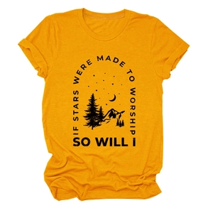 Detail of screen-printed mountain and star graphics on a mustard yellow cotton T-shirt