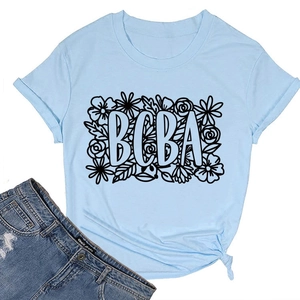 Flat lay of light blue BCBA graphic T-shirt with vintage wash denim jeans in detail