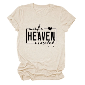 Close-up of black 'make HEAVEN crowded' text and heart print on oatmeal t-shirt