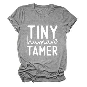 Detail of grey T-shirt with white Tiny Human Tamer graphic and soft crew neck finish