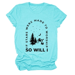 Close-up of mountain and moon print with inspirational quote on teal cotton t-shirt
