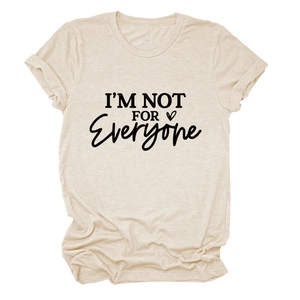 Close-up of oatmeal cotton t-shirt featuring I'M NOT FOR EVERYONE text and heart icon