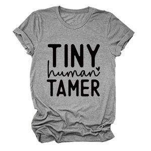 Detailed flat lay of heather gray t-shirt featuring black TINY human TAMER print design