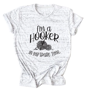 Close-up of Heather gray women's T-shirt featuring a funny crochet hobby quote and graphic