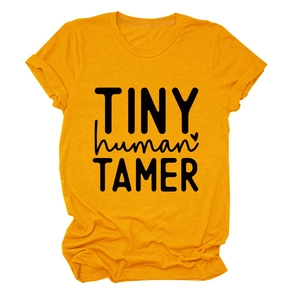 Detail of Tiny Human Tamer slogan print on yellow cotton t-shirt with rolled sleeves