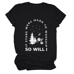 Detailed flat lay of black crew neck T-shirt featuring starry mountain forest print