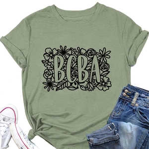 Detail of green T-shirt with BCBA lettering and floral print on soft cotton fabric
