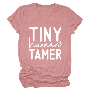 Pink crew neck T-shirt with white Tiny Human Tamer artistic lettering and soft texture