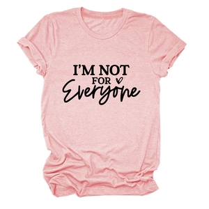 Flat lay of pink cotton T-shirt with I'M NOT FOR EVERYONE slogan and heart print