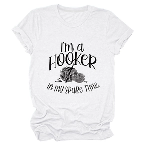 Close-up of crochet themed graphic and typography on a white cotton T-shirt