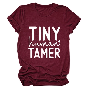 Detail view of burgundy cotton blend t-shirt with white Tiny Human Tamer typography