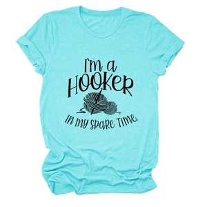 Flat lay of a teal crew neck T-shirt with hooker crochet pun print and soft texture