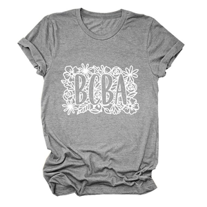 Detail of floral BCBA print and rolled sleeves on dark grey cotton crew neck T-shirt