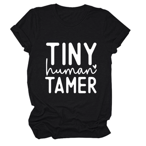 Detail of Tiny Human Tamer text print and soft cotton fabric on black casual T-shirt