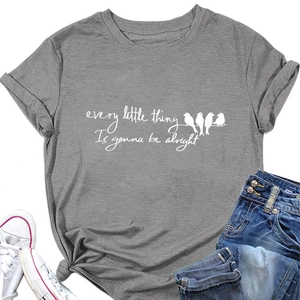 Flat lay of grey t-shirt with birds on wire print and every little thing slogan