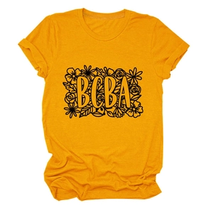 Close-up of BCBA floral print on a ginger yellow cotton t-shirt with crew neck design