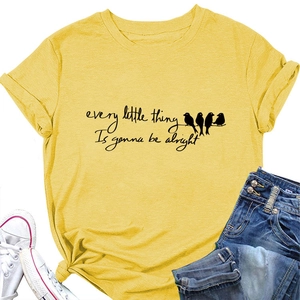 Detail of yellow cotton t-shirt featuring bird graphics and knotted hem detail