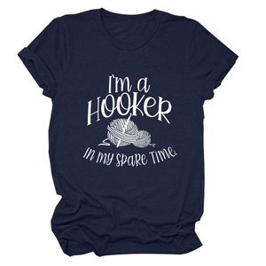 Close-up of navy blue T-shirt with white I'm a Hooker in My Spare Time crochet graphic