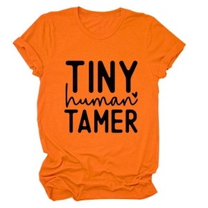 Detail of cotton orange t-shirt showing TINY human TAMER print and round neck collar