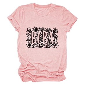 Close-up of BCBA floral print on a pink crewneck t-shirt with high-quality fabric detail