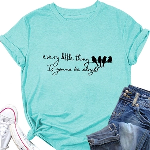 Flat lay of mint green T-shirt with every little thing is gonna be alright quote