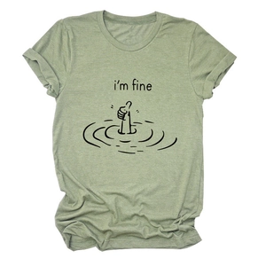 Close-up of grass green t-shirt featuring black i'm fine print and thumb up graphic