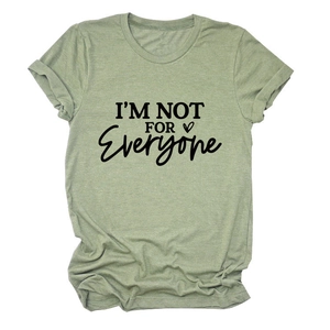 Close-up of grass green cotton T-shirt with black I'M NOT FOR EVERYONE heart graphic