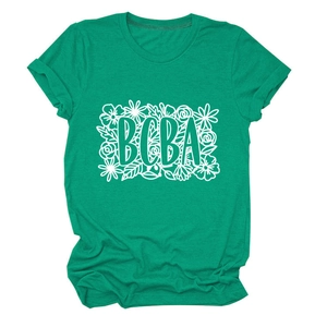 Detail of bright green cotton T-shirt featuring BCBA floral print and cuffed sleeves