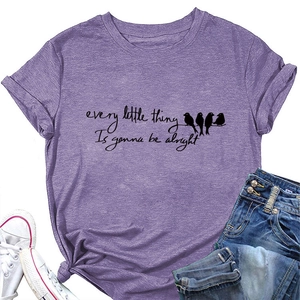 Detail of purple cotton t-shirt featuring bird print and inspirational text