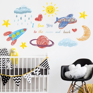 Detail of colorful hand-drawn cartoon rocket and planet wall stickers for kids rooms