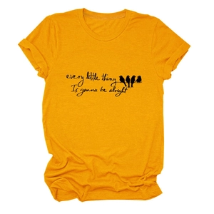 Detail of mustard yellow t-shirt with slogan and birds on wire print and rolled sleeves