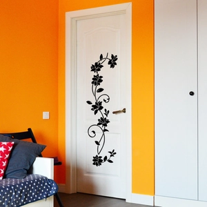 Black floral vine wall sticker design shown on a white door for home decoration
