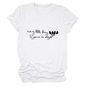 Close-up of bird graphic and 'every little thing' motivational print on white cotton T-shirt