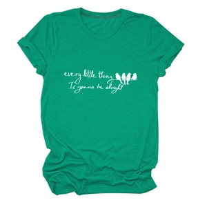 Close-up of Every Little Thing text and bird print on green cotton t-shirt fabric