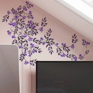 Detail of purple floral vine wall stickers with blooming flowers and green leaves