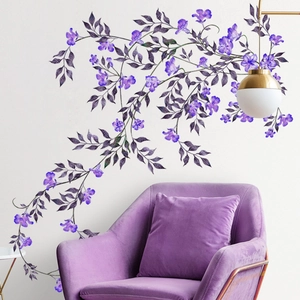 Purple floral vine wall decals displayed above a velvet sofa for home interior decor