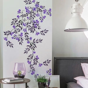 Detail of elegant purple flower vine wall stickers in a modern bedroom setting