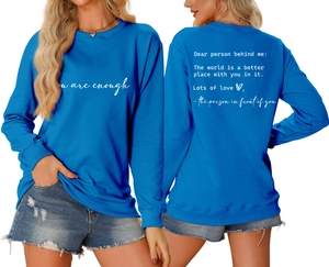 Detail of navy crewneck sweatshirt with 'Dear person behind me' message on the back