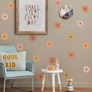 Boho daisy flower wall stickers in warm pink and orange tones for kids nursery decor