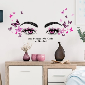 Inspirational wall sticker with butterfly and eye motif on minimalist white wall