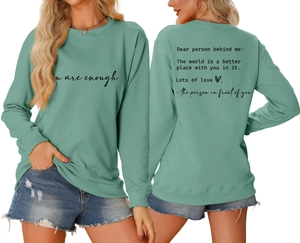 Detailed front and back view of mint green sweatshirt with 'you are enough' quote print